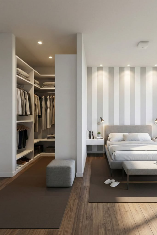 Banheiro aberto para o quarto com banheira de imersão, bancada de quartzo com duas cubas e revestimento em tons neutros.